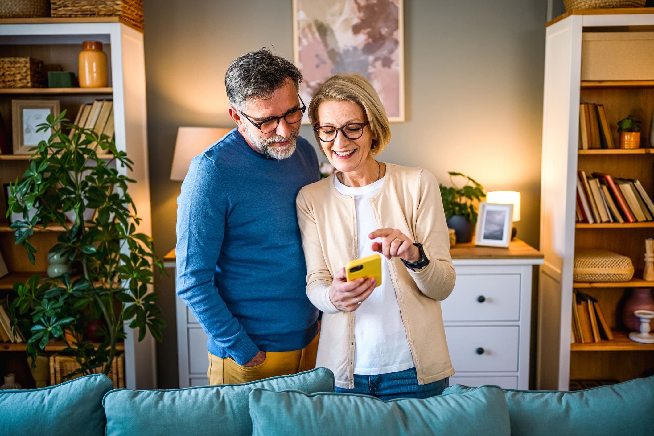 Mature couple using mobile phone